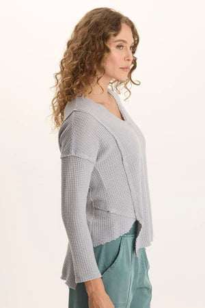 XCVI Arnie Thermal Asymmetrical Hem V-Neck Top  in Soft Pebble Pigment