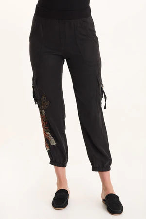 Black cargo pants with embroidery on a white background